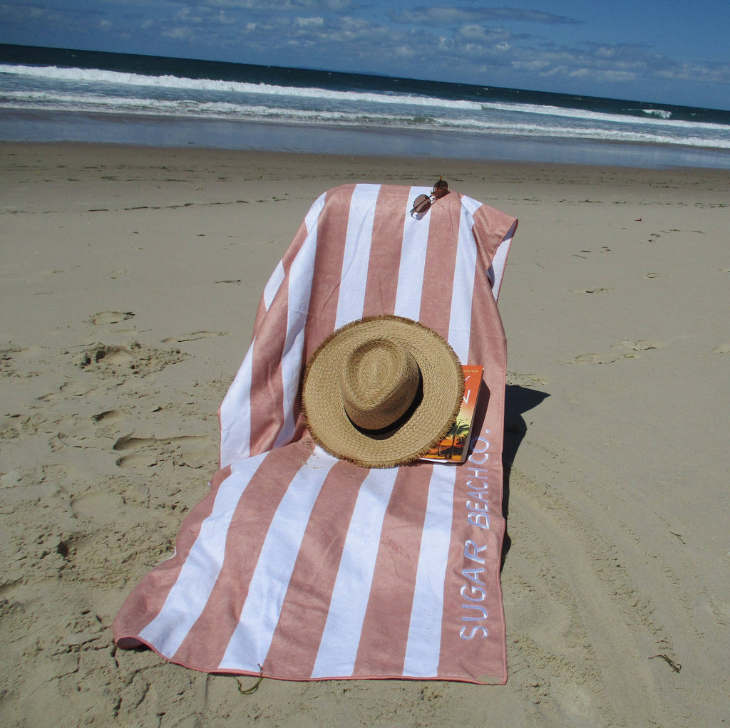 towel and a beach hat