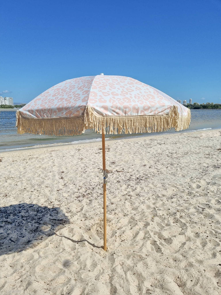 Opened umbrella on the beach
